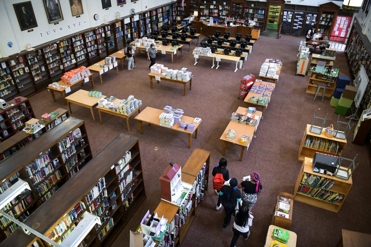 Students pick up textbooks at a high school in Los Angeles on Aug. 13, 2020. (Rodin Eckenroth/Getty Images)
