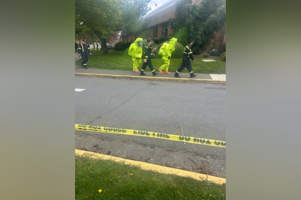 Members of the Capital Regional District Hazmat Team are seen responding to a hazardous materials incident involving chlorine gas exposure at the Crystal Pool, in Victoria in a April 10, 2026, handout photo. (The Canadian Press/Handout - City of Victoria)