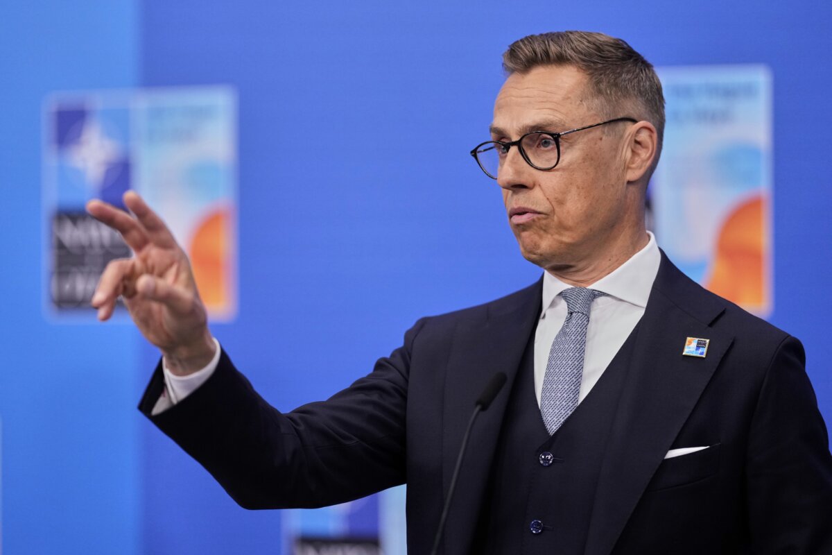 Finland's President Alexander Stubb speaks with the media as he arrives for the NATO summit in The Hague, Netherlands, on June 25, 2025. (AP Photo/Matthias Schrader)