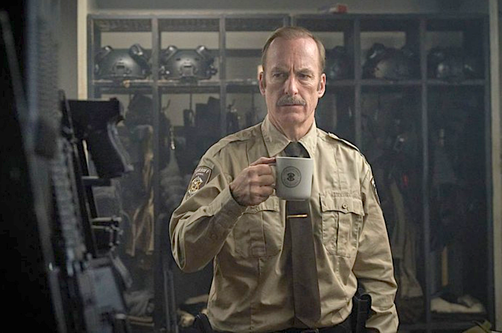 Sheriff drinks coffee in armory in Normal