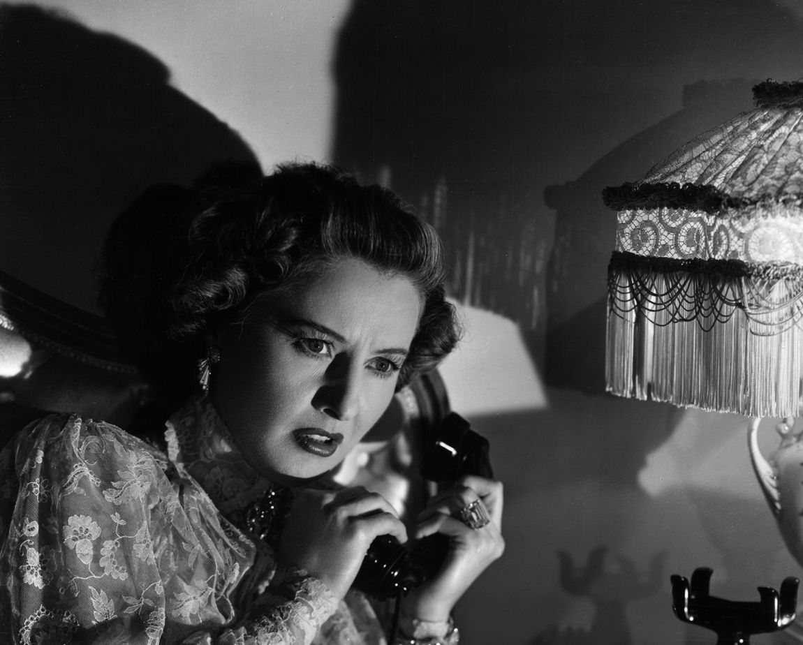 Leona Stevenson (Barbara Stanwyck) is bedridden and intercepts a mysterious message, in "Sorry, Wrong Number." (Paramount Pictures)
