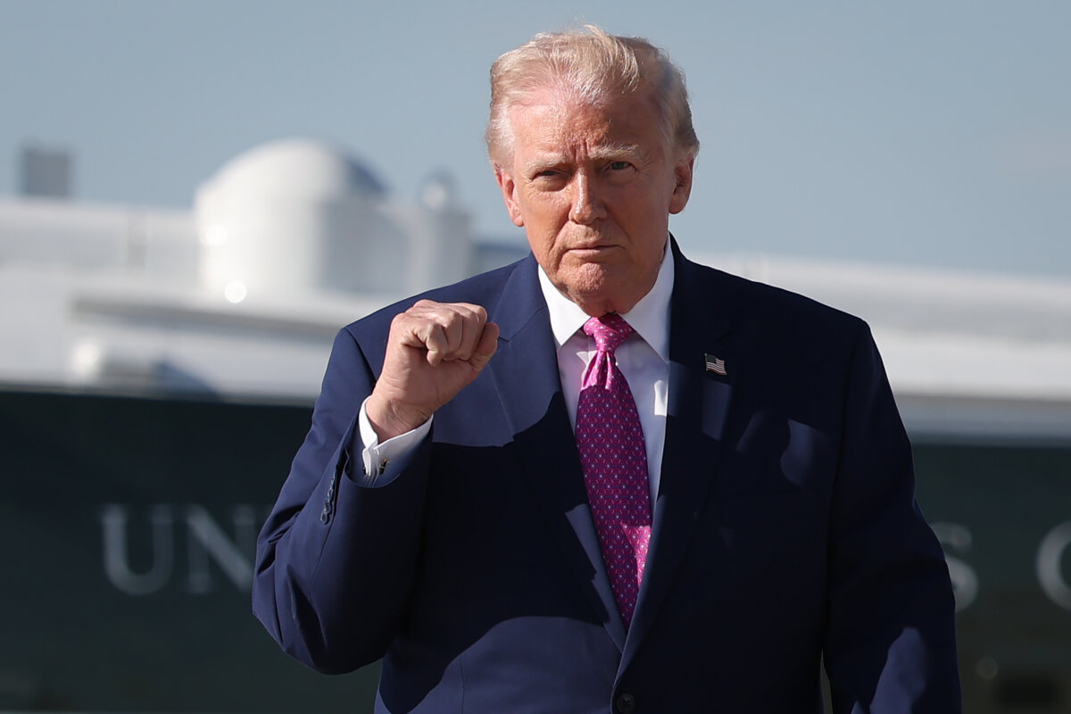 President Donald Trump walks toward reporters before answering questions prior to boarding Air Force One at Joint Base Andrews, Md., on April 10, 2026. (Win McNamee/Getty Images)