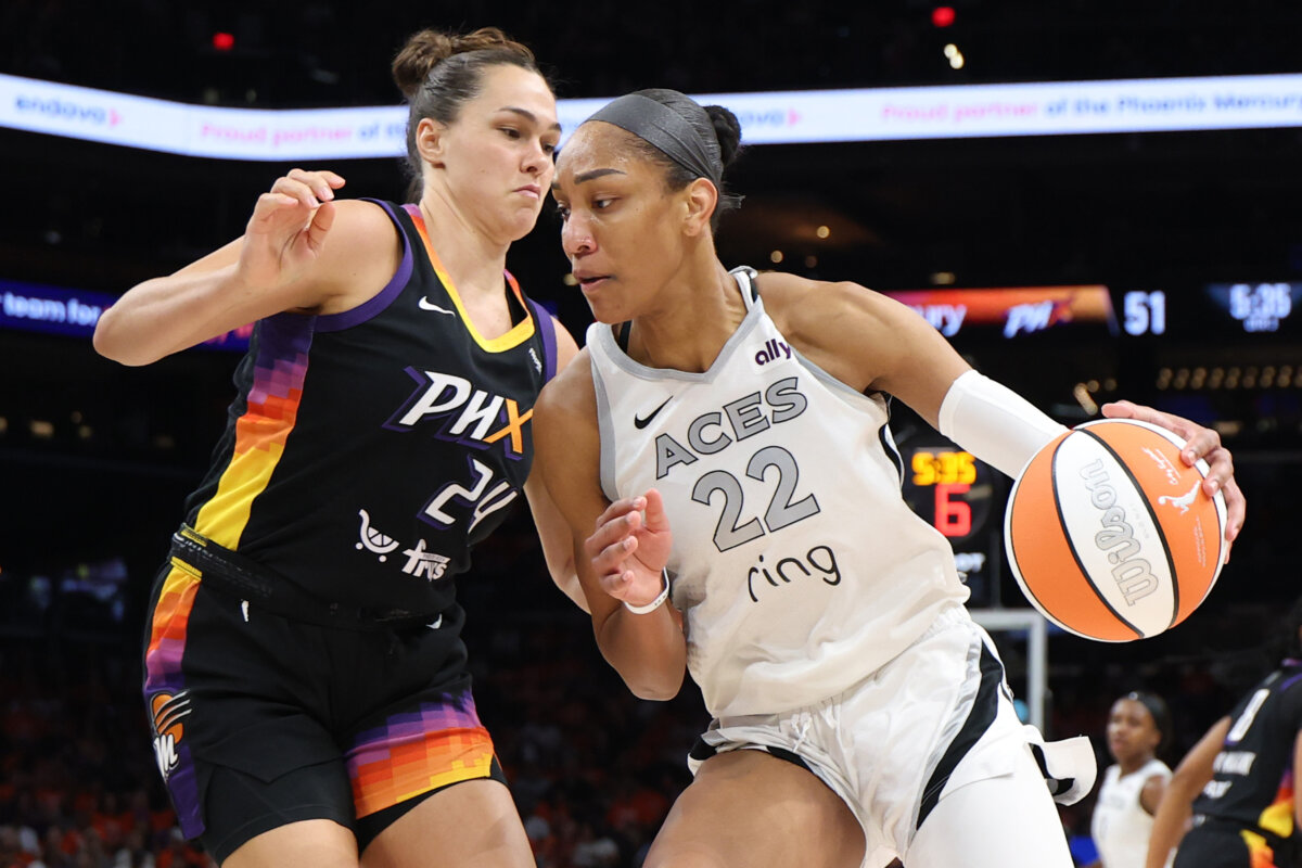A'ja Wilson (22) of the Las Vegas Aces drives to the basket against Kathryn Westbeld (24) of the Phoenix Mercury in the third quarter of Game Three of the 2025 WNBA Playoffs finals at Mortgage Matchup Center in Phoenix, Ariz., on Oct. 8, 2025. (Christian Petersen/Getty Images)