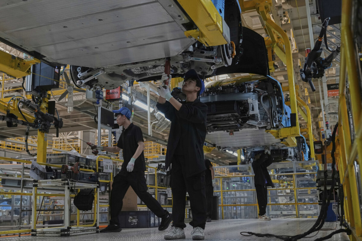 Workers assemble the Zeekr 001 EV models at the Chinese automaker Zeekr assembly plant, in Ningbo, Zhejiang Province, China, on April 17, 2025. (Andy Wong /AP Photo)