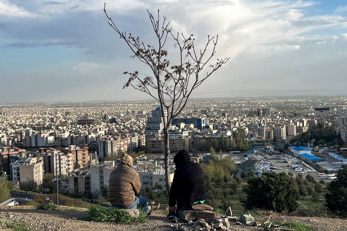 People sit overlooking the city at Pardisan Park in Tehran, Iran, on April 14, 2026. (AFP via Getty Images)