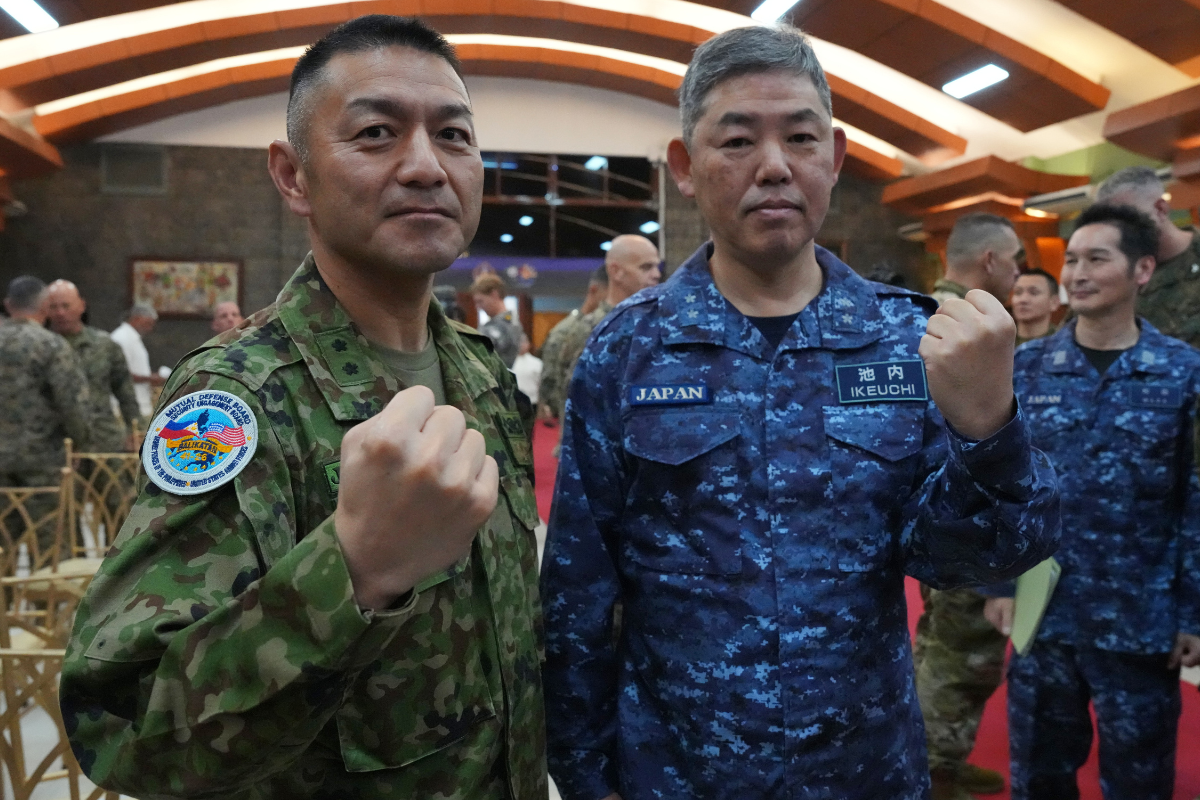 Japan army Maj. Gen. Toshikatsu Musha (L) and Japan navy Rear Admiral Izuru Ikeuchi (R) pose as they participate during the opening ceremonies of the joint military exercise dubbed "Balikatan" or "Shoulder to Shoulder", Monday, April 20, 2026, at Camp Aguinaldo military headquarters in Quezon city, Philippines. (AP Photo/Aaron Favila)