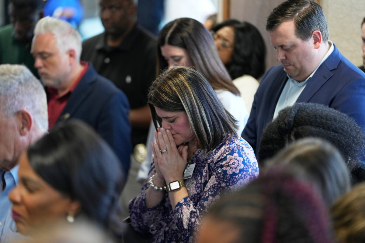 Attendees pray at the conclusion of a news conference about the children killed during a mass shooting the day before in Shreveport, La., on April 20, 2026. (Gerald Herbert/AP Photo)