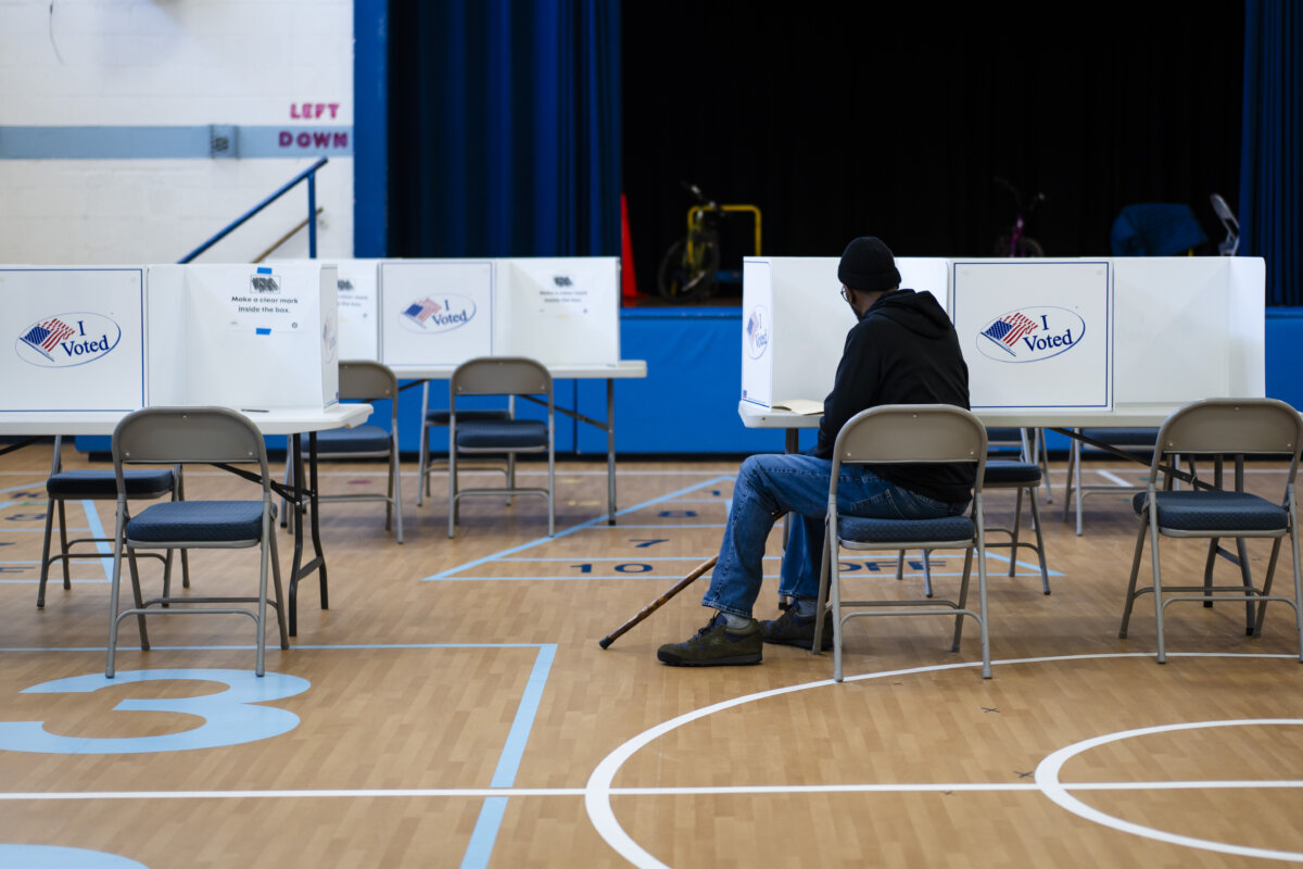 A voter at a polling site during the redistricting referendum in Alexandria, Va., on April 21, 2026. (Madalina Kilroy/The Epoch Times)