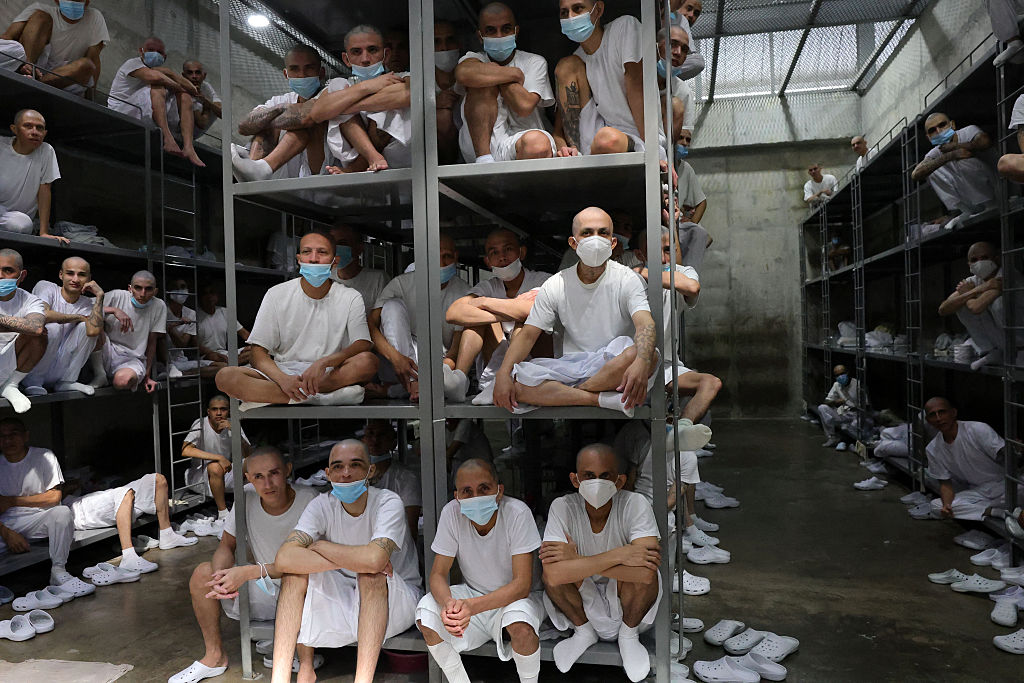 Inmates during a visit by Chile's President-elect Jose Antonio Kast (out of frame) to the Counter-Terrorism Confinement Centre (CECOT) mega-prison, where hundreds of MS-13 and 18th Street gang members are being held, in Tecoluca, El Salvador, on Jan. 30, 2026. (Oscar Rivera / AFP via Getty Images)