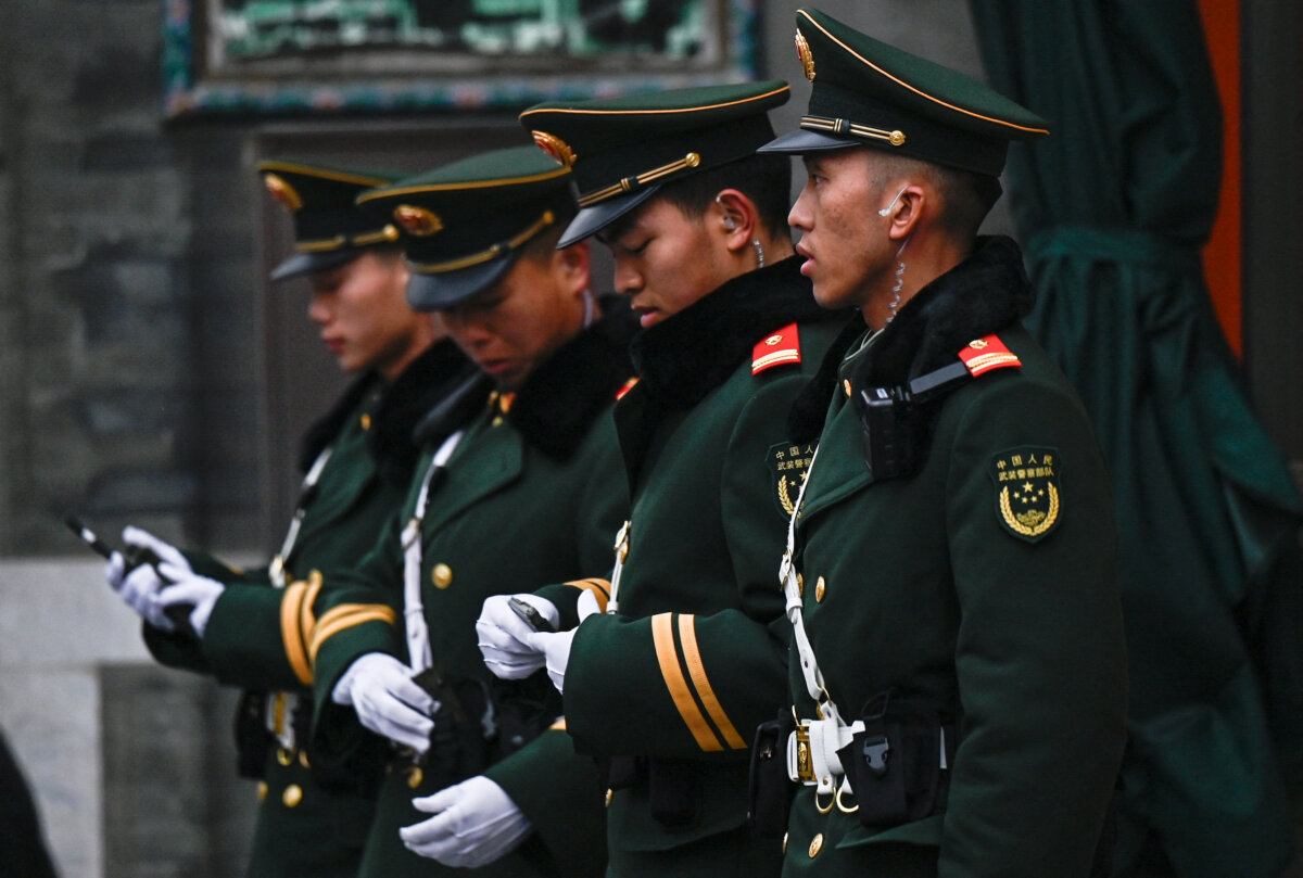 Chinese paramilitary policemen stand guard in a street surrounding the Great Hall of the People where the opening of the Chinese People's Political Consultative Conference takes place, in Beijing on March 4, 2026. (Pedro Pardo/AFP via Getty Images)