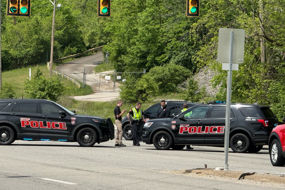 Police block a road near a chemical plant where a leak occurred in Institute, W.Va., on April 22, 2026. (John Raby/AP Photo)