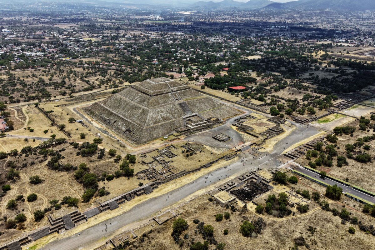 Tourists visit the pyramids of the Teotihuacan archaeological zone in Teotihuacan, Mexico, on April 22, 2026. The world-famous landmark has officially reopened days after a gunman killed a Canadian woman, injured 13 others, and then took his own life at the site. (Zina Desmazes/AFP via Getty Images)