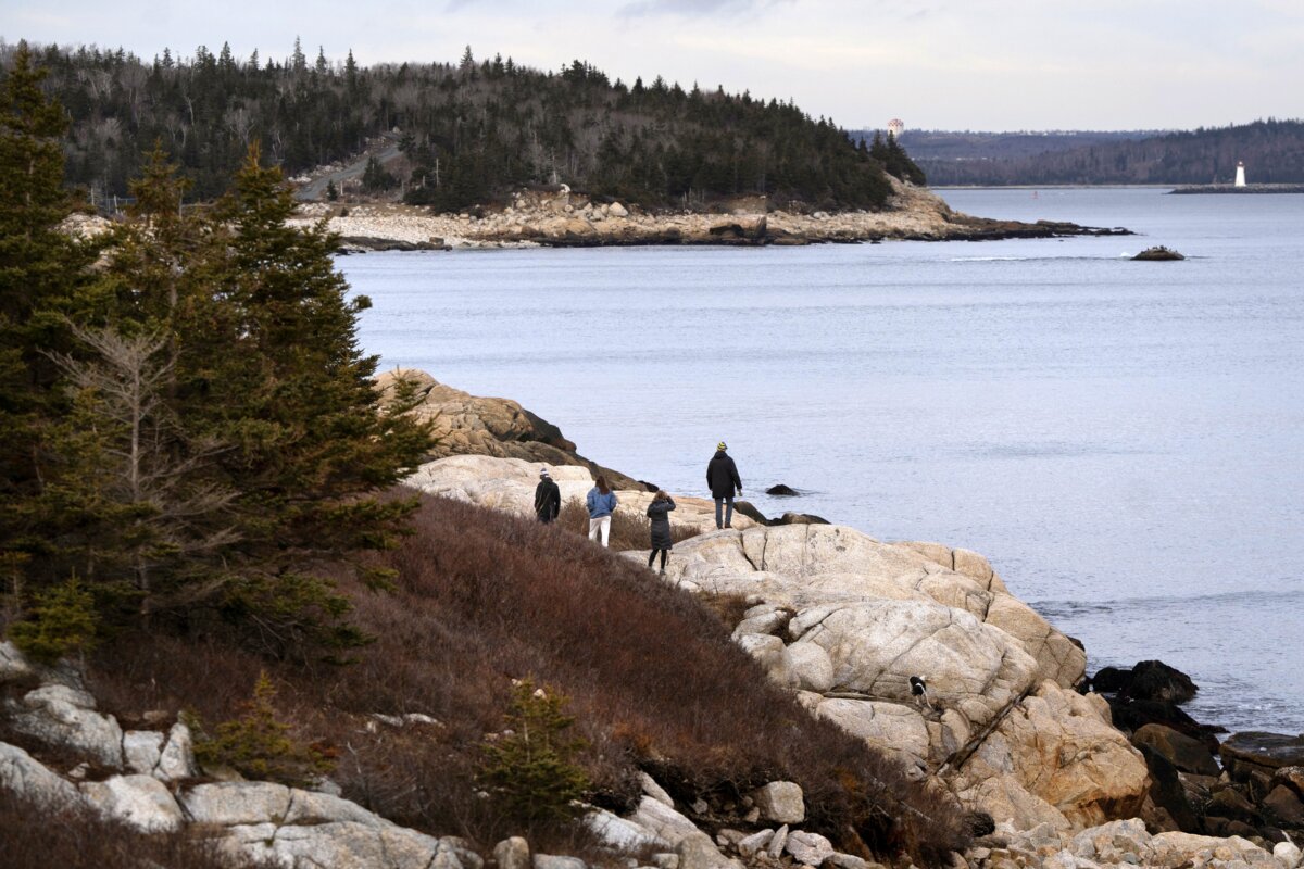 People hike along the rocky coastline at Herring Cove Provincial Park in Nova Scotia in a file photo. (The Canadian Press/Darren Calabrese)