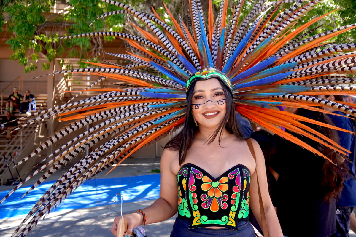 A woman in traditional Native American ceremonial dress prepares to enter Tingley Coliseum for the final Gathering of Nations powwow in Albuquerque, N.M., on April 24, 2026. (Allan Stein/The Epoch Times)