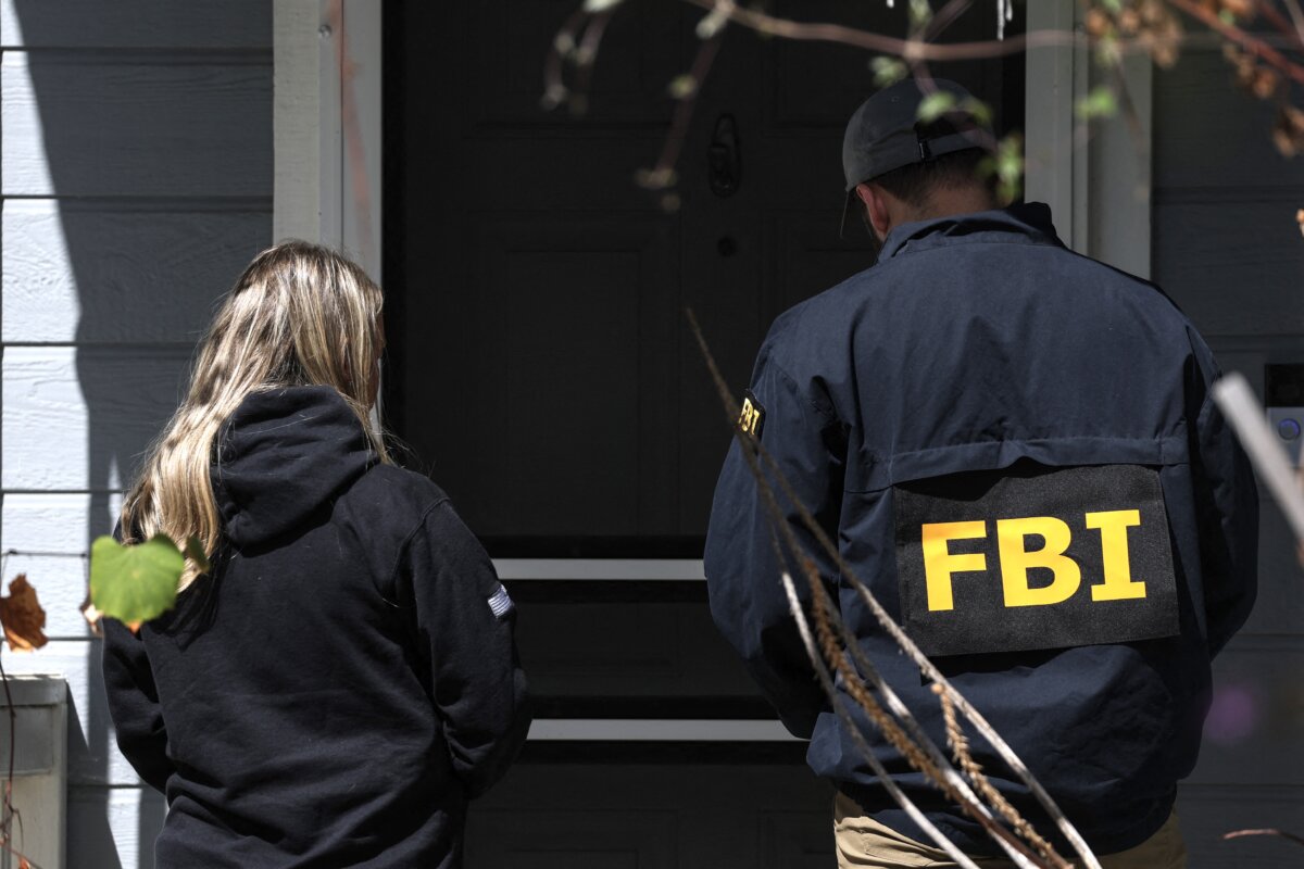 Members of the FBI knock on doors of neighbors of a home associated with the suspected White House Correspondents’ Dinner shooter in Torrance, California, on April 26, 2026. (Patrick T. Fallon/AFP via Getty Images)