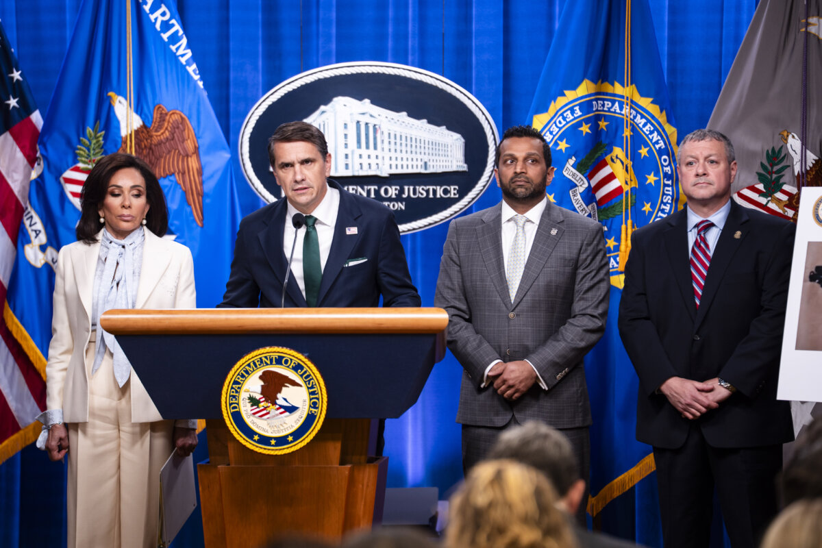 (L-R) U.S. Attorney Jeanine Pirro, Acting Attorney General Todd Blanche, FBI Director Kash Patel, and Assistant Director Darren Cox, during a press conference about the White House Correspondents' Dinner shooting, at the Justice Department in Washington on April 27, 2026. (Madalina Kilroy/The Epoch Times)