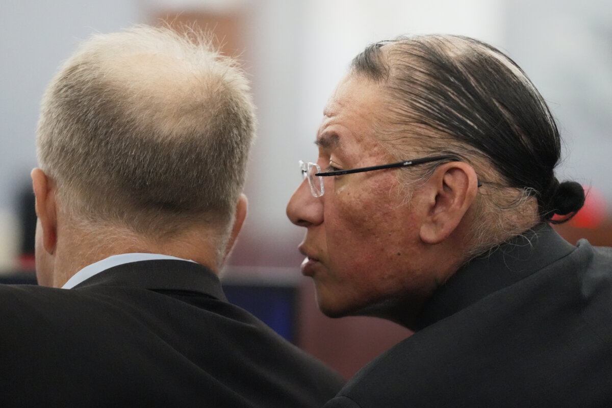 Nathan Chasing Horse, right, talks to his attorney Craig Mueller during his trial on charges of sexually abusing Indigenous women and girls in Las Vegas, on Jan. 13, 2026. (AP Photo/Ty ONeil, file)