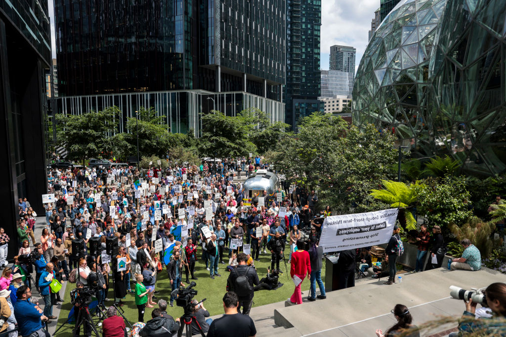 Amazon employees and supporters gather during a walk-out protest against layoffs, a return-to-office mandate, and the company's environmental impact, outside Amazon headquarters in Seattle, Washington, on May 31, 2023. (Jason Redmond/AFP via Getty Images)