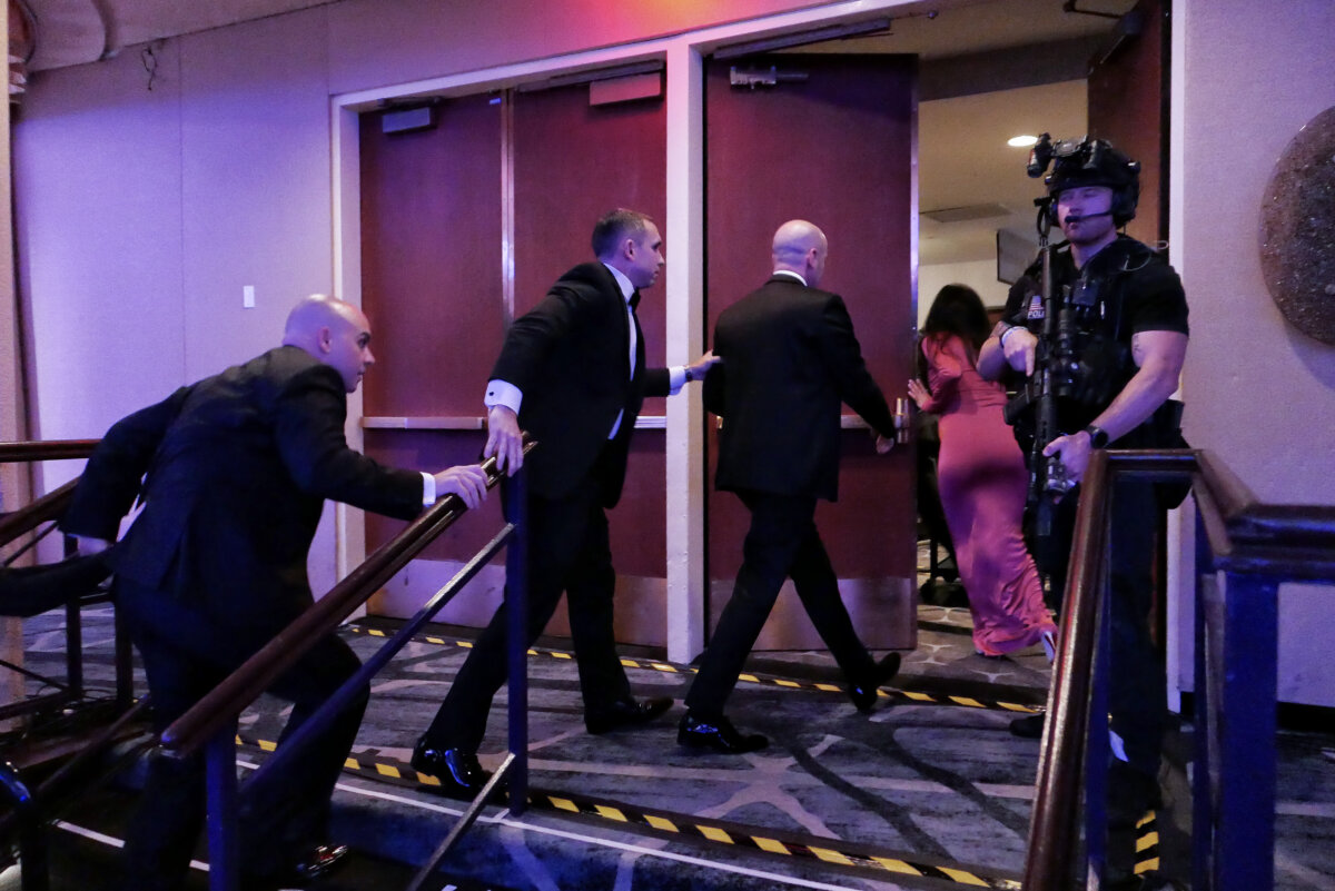 Guests are escorted out after a shooting incident at the White House Correspondents' Dinner on April 25, 2026. (Chip Somodevilla/Getty Images)
