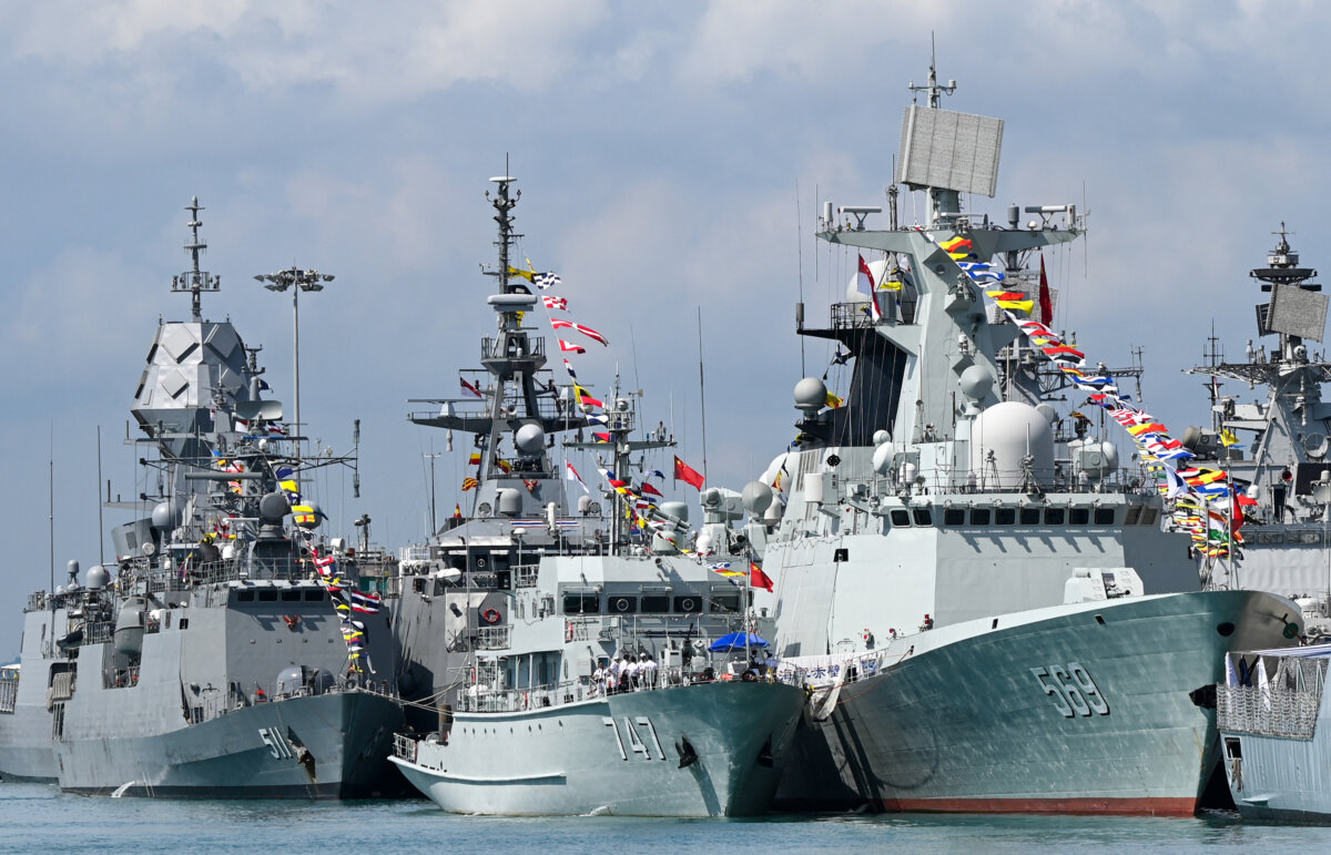 Chinese Navy missile frigate Yulin (R) and the minesweeper hunter Chibi (C) are seen docked at Changi Naval Base during the IMDEX Asia warships display in Singapore on May 4, 2023. (Roslan Rahman/AFP via Getty Images)