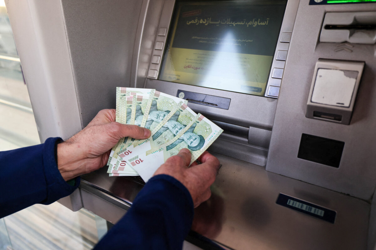 An Iranian citizen withdraw money from an ATM machine, Tehran, Iran, on Jan. 7, 2026. (Atta Kenare/AFP via Getty Images)