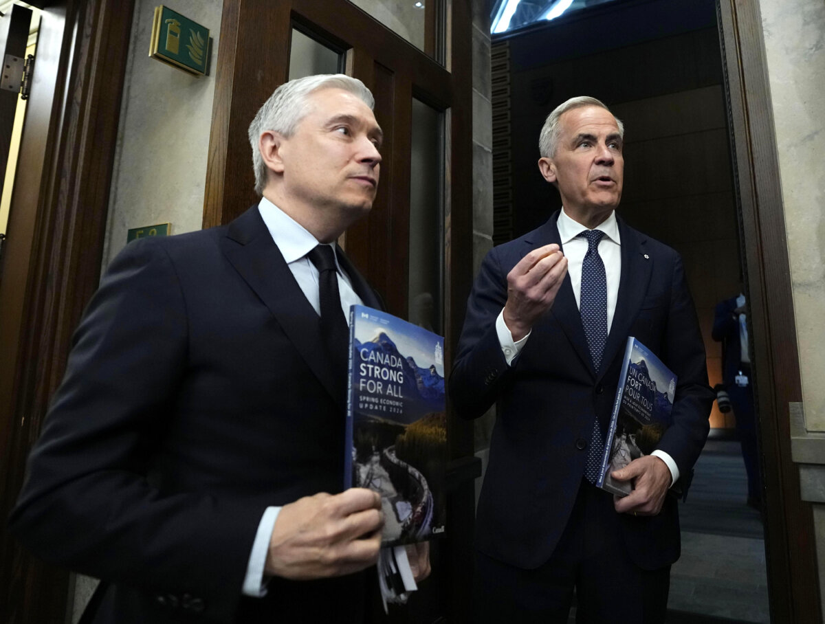 Prime Minister Mark Carney and Finance Minister Francois-Philippe Champagne make their way to the House of Commons before delivering the spring economic update on Parliament Hill in Ottawa on April 28, 2026. (The Canadian Press/Justin Tang)