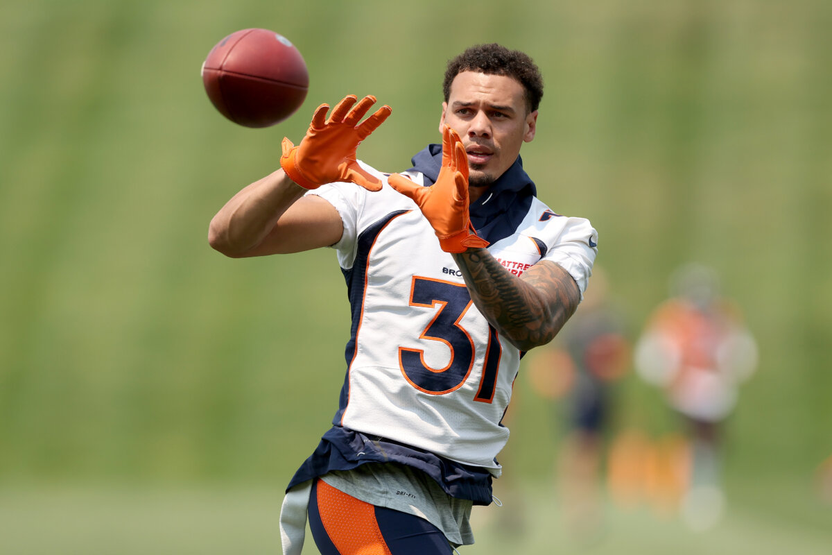Justin Simmons #31 of the Denver Broncos catches a ball during a mandatory mini-camp at UCHealth Training Center in Englewood, Colo., on June 13, 2022. (Matthew Stockman/Getty Images)