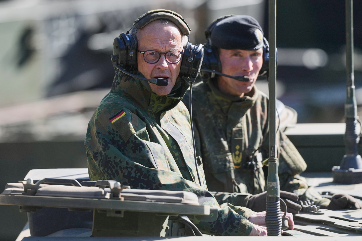German Chancellor Friedrich Merz drives in the armoured fighting vehicle Boxer during his visit to the army at the Bundeswehr base in Munster, Germany, on April, 30, 2026. (Markus Schreiber/AP Photo/Pool)