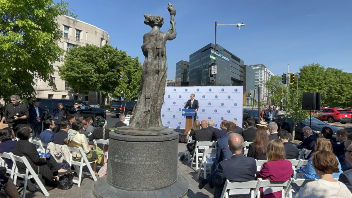 Former U.S. Ambassador Sam Brownback speaks at the 19th Annual Roll Call of Nations Wreath Laying Ceremony, attended by representatives from more than 60 embassies and groups, at the Victims of Communism Memorial in Washington on April 23, 2026. (The Epoch Times)