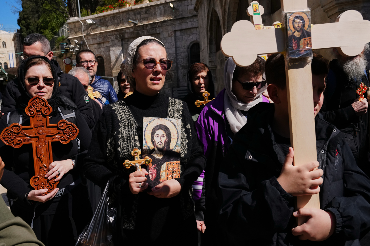 Orthodox Christian pilgrims carry crosses during the Good Friday procession in the Old City of Jerusalem, in Israel, on April 10, 2026. (Mahmoud Illean/AP Photo)