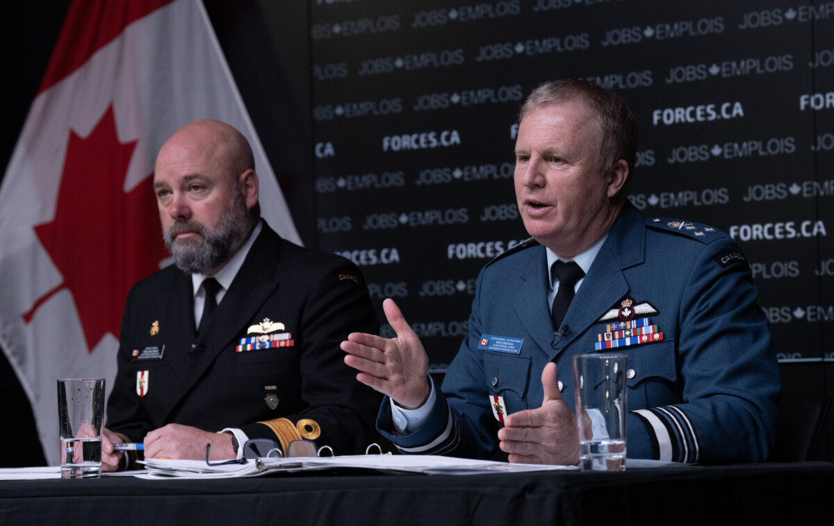Canadian Forces Military Personnel generation group commodore Pascal Belhumeur (L) looks on as Chief of Military Personnel and Commander of Military Personnel Command Lt-Gen. Erick Simoneau responds to a question during a briefing about recruitment efforts in Ottawa on April 20, 2026. (Adrian Wyld/The Canadian Press)