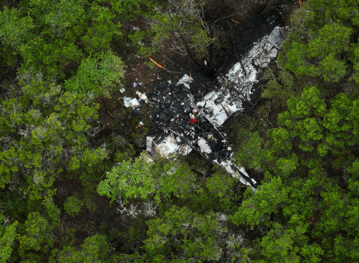 A crashed Cessna airplane in a wooded area on Round Rock Road in Wimberley, Texas, on May 1, 2026. (Jay Janner/Austin American-Statesman via AP)
