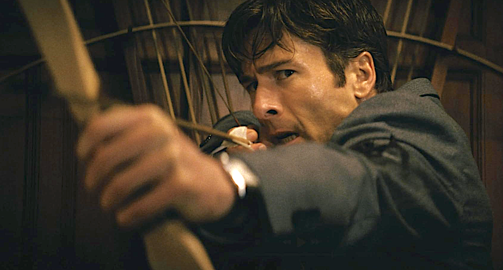 man with bow and arrow in How to Make a Killing