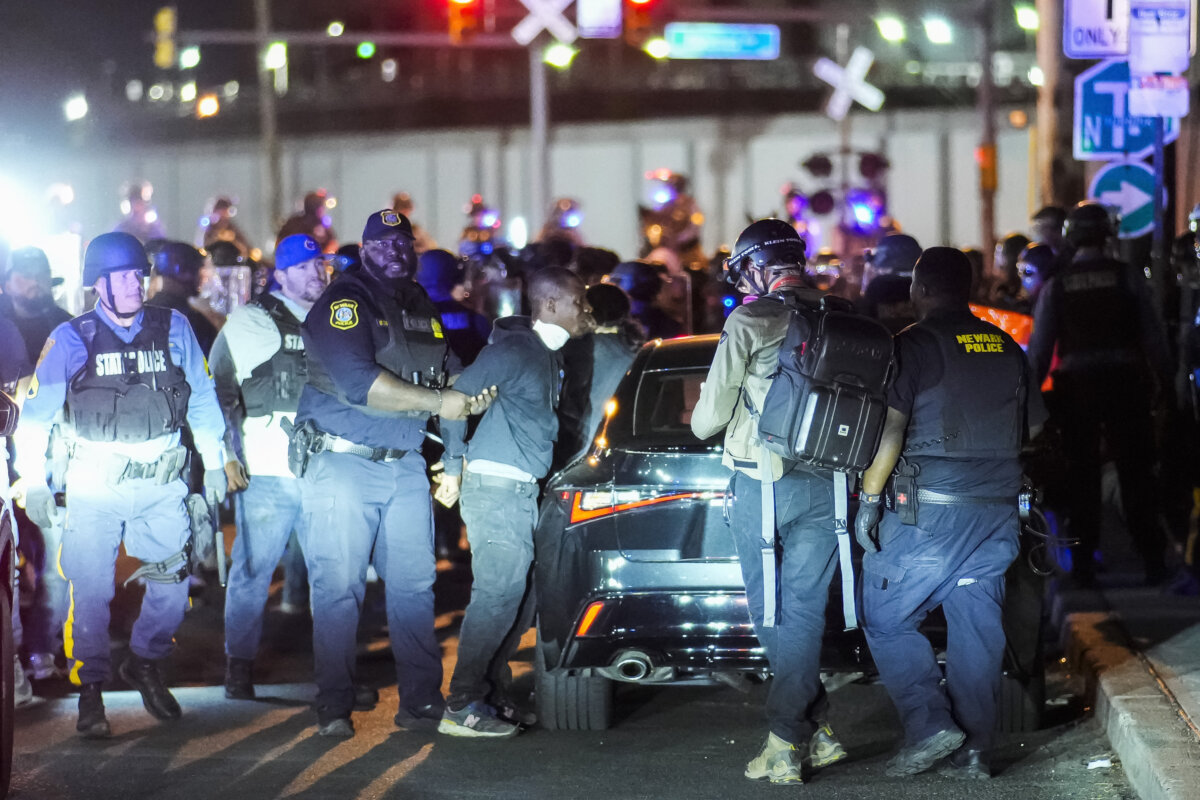 New Jersey state police arrest a protester outside Delaney Hall, which is being used as an Immigration and Customs Enforcement (ICE) detention center, during a curfew, in Newark, N.J., on May 31, 2026. (Eduardo Munoz/AFP via Getty Images)