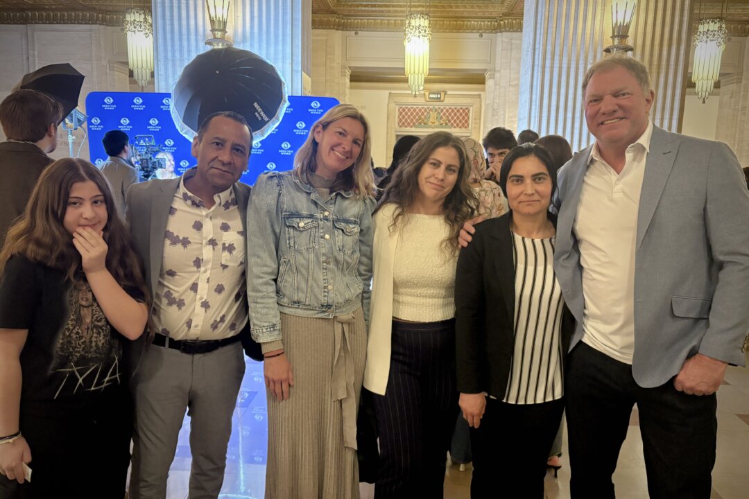 Jason Jones (far R) with family and friends enjoyed Shen Yun's evening show at Chicago's Civic Opera House on May 2, 2026. (Stacey Tang/The Epoch Times)