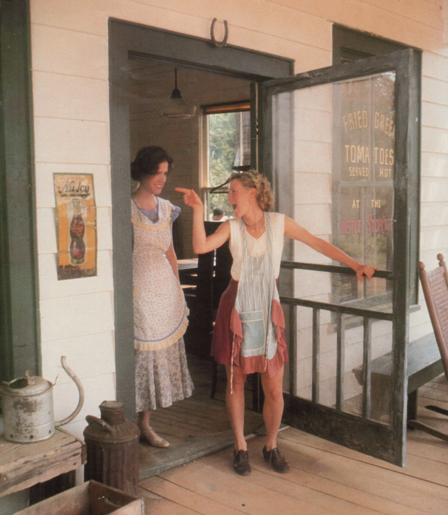 Two women in an open door on a porch in