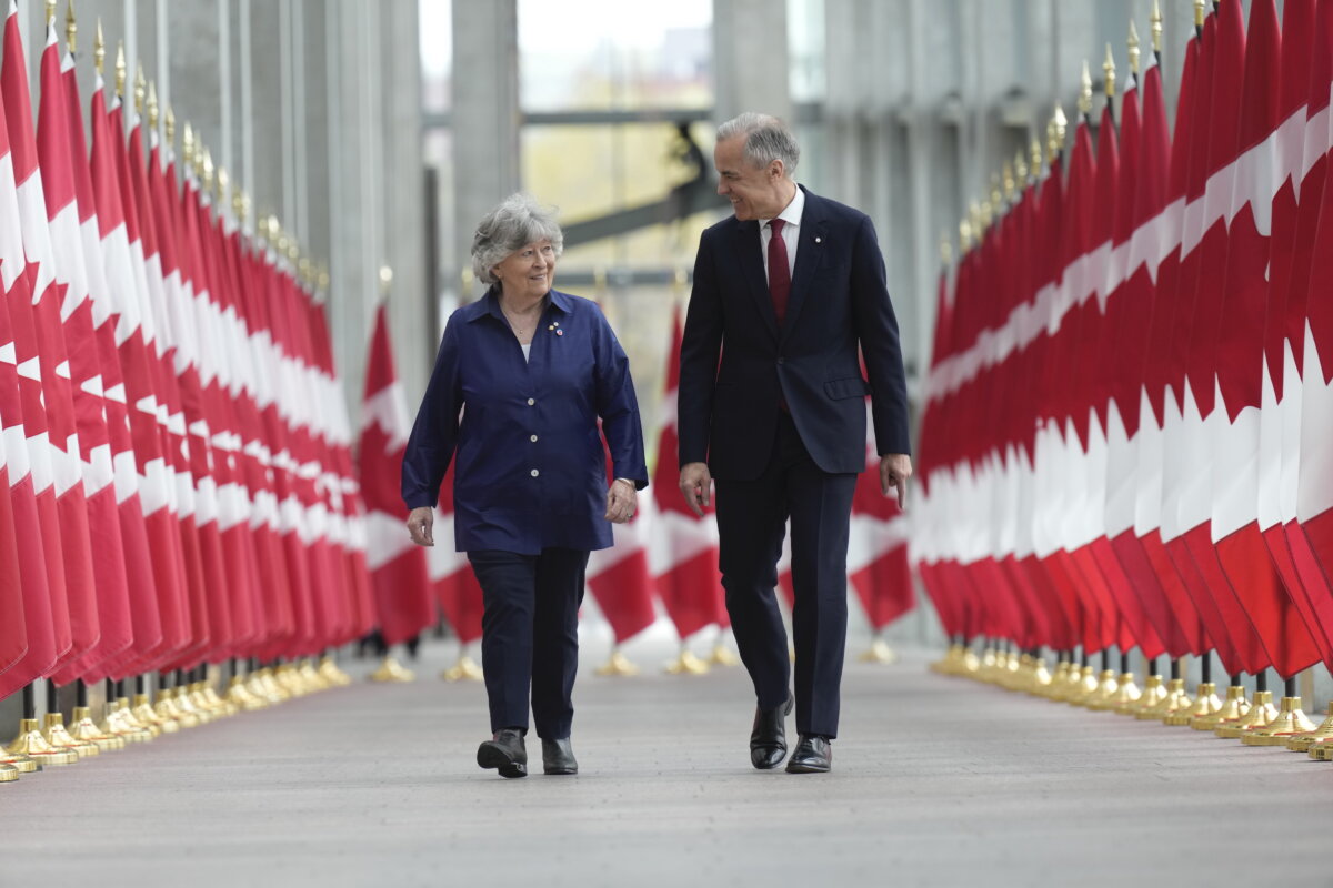 Prime Minister Mark Carney walks with Louise Arbour to announce the new governor general during an event in Ottawa, May 5 2026. (The Canadian Press/Adrian Wyld)
