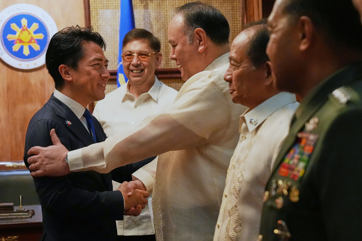 Philippine Defense Secretary Gilbert Teodoro Jr. greets his counterpart Japan's Shinjiro Koizumi, left, at the Malacanang presidential palace in Manila, Philippines on May 5, 2026. (Aaron Favila/Pool/AP Photo)