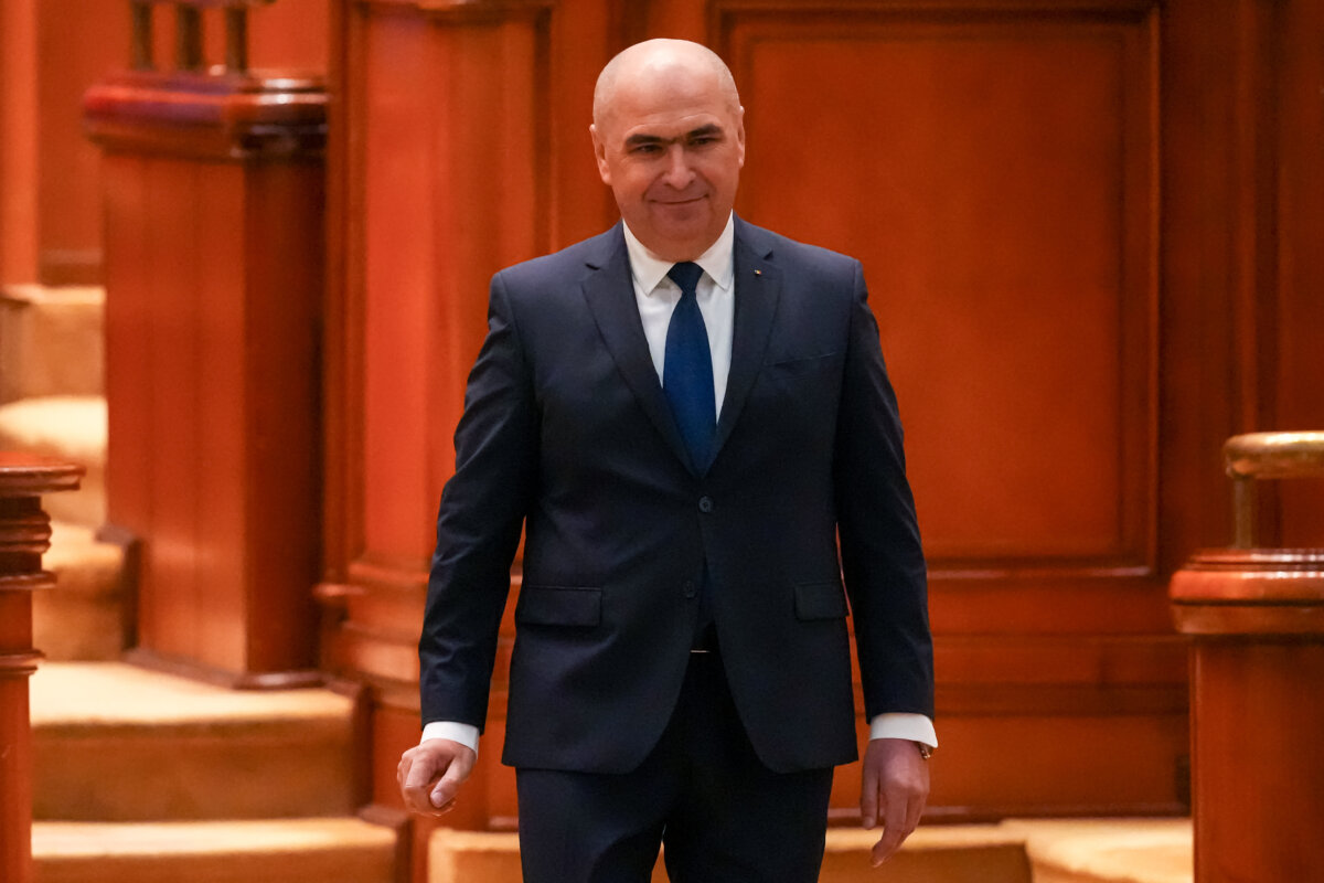 Romanian Prime Minister Ilie Bolojan arrives at a parliament session ahead of a no confidence vote in Bucharest, Romania, on May 5, 2026. (Vadim Ghirda/AP Photo)