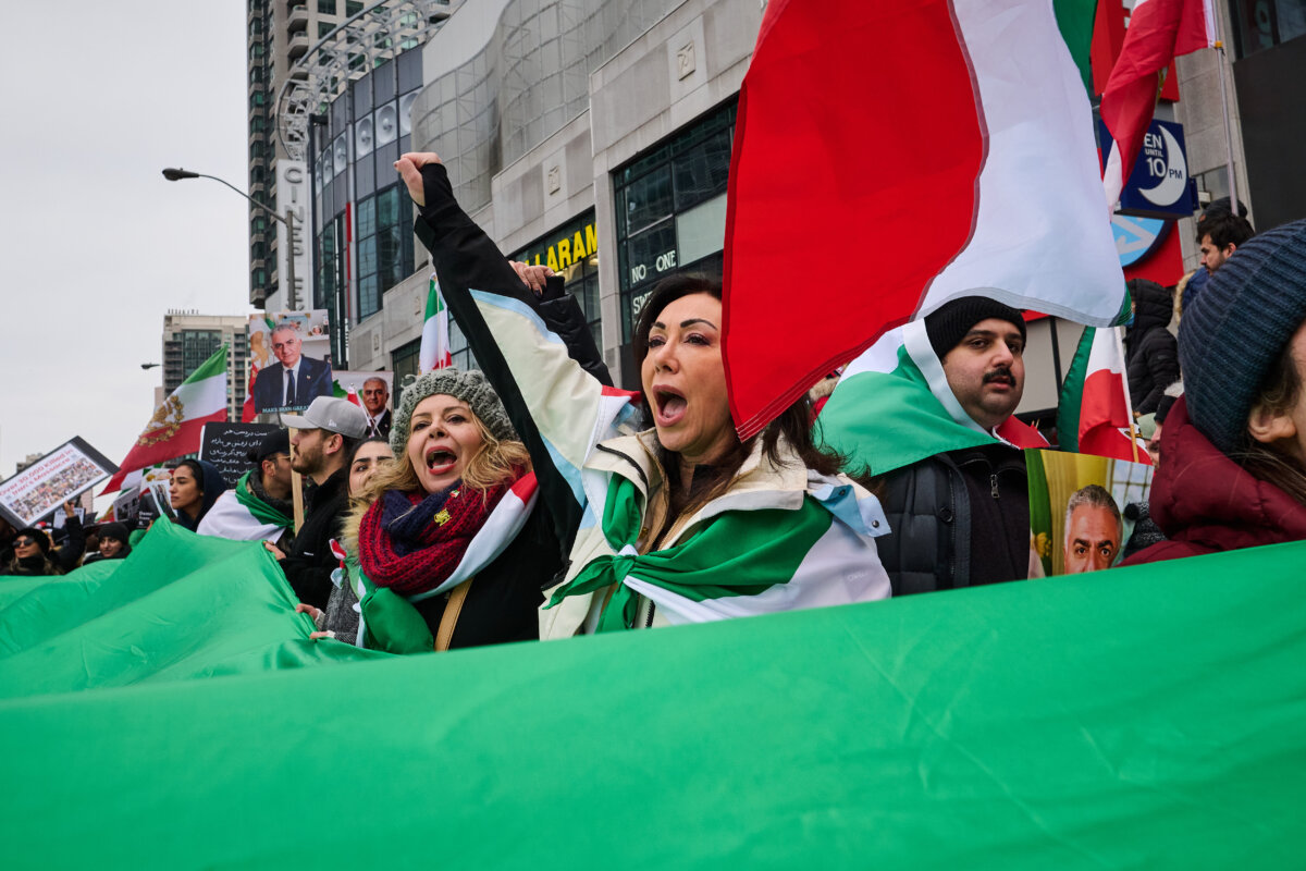 Protesters march in support of regime change in Iran during a demonstration in Toronto, on Feb. 14, 2026. (The Canadian Press/Sammy Kogan)