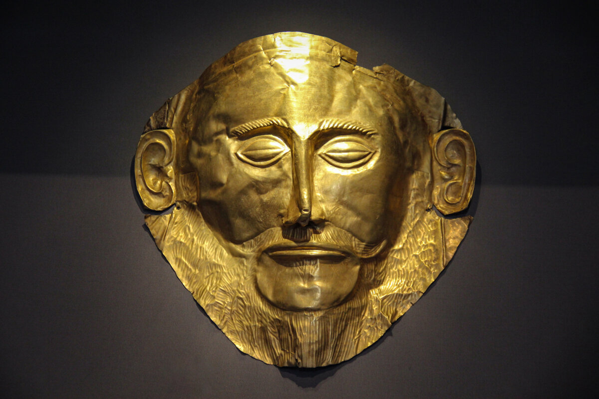 Gold death-mask, known as the “Mask of Agamemnon” from 16th-century B.C. Mycenae. The two holes near the ears suggest that the mask was tied in place with twine. (Public Domain)