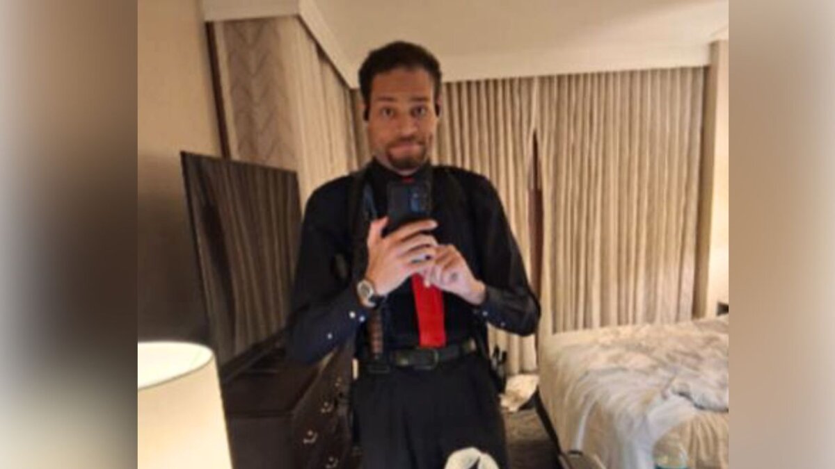 Cole Tomas Allen inside his hotel room in Washington, on April 25, 2026, using his cellphone to take a photograph of himself in the mirror. (Department of Justice via AP)