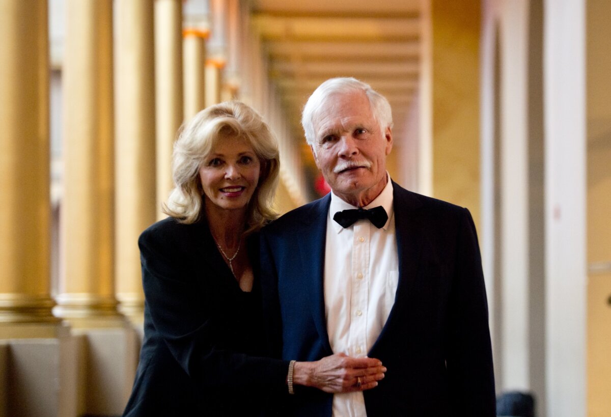 Ted Turner, founder of CNN, and Sally Ranney (L) arrive to attend the Lone Sailor Awards Dinner at the National Building Museum in Washington on Sept. 18, 2013. (Saul Loeb/AFP via Getty Images)