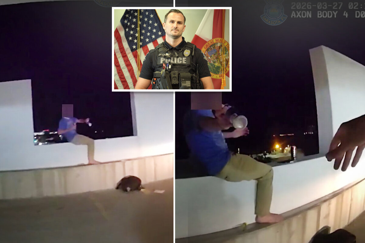 Footage from Officer Michal Banasiak's bodycam shows a young man in a metal health crisis in the process of being rescued from a ledge atop a six-story parkade in Sarasota, Fla. (Sarasota Police Department)