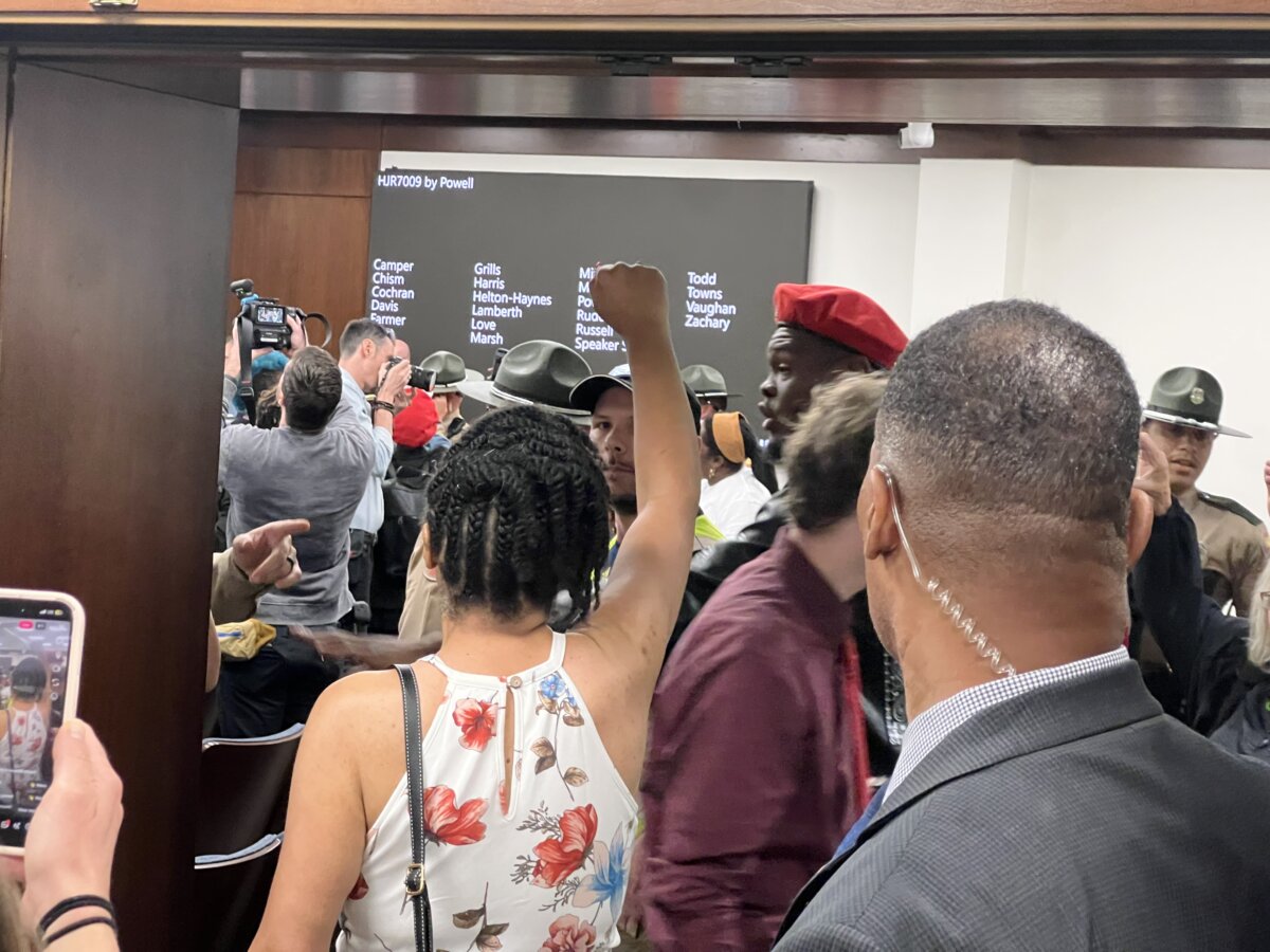 Protesters chanted and were escorted out of a hearing as State House lawmakers voted on an amendment to a new restricting proposal May 6, 2026. (Jacki Thrapp / The Epoch Times)