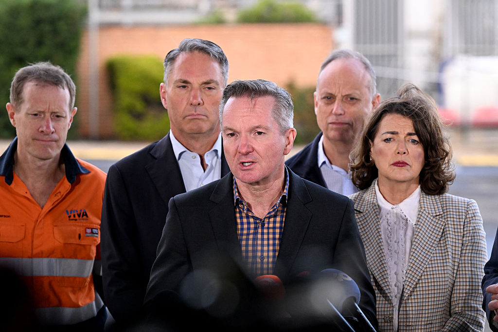 Minister for Climate Change and Energy Chris Bowen (C) speaks at a press conference during a visit to the Geelong Oil Refinery in Geelong near Melbourne, Australia on April 17, 2026. (William West/AFP via Getty Images)