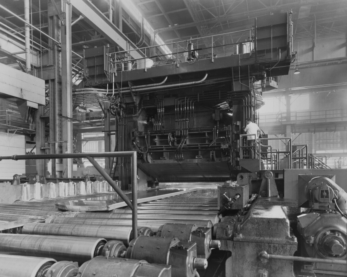A man operating an aluminum rolling mill at the Davenport Works of the Aluminum Company of America (later known as the Alcoa Corporation) in Davenport, Iowa, circa 1965. (Aluminum Company of America/FPG/Archive Photos/Getty Images)