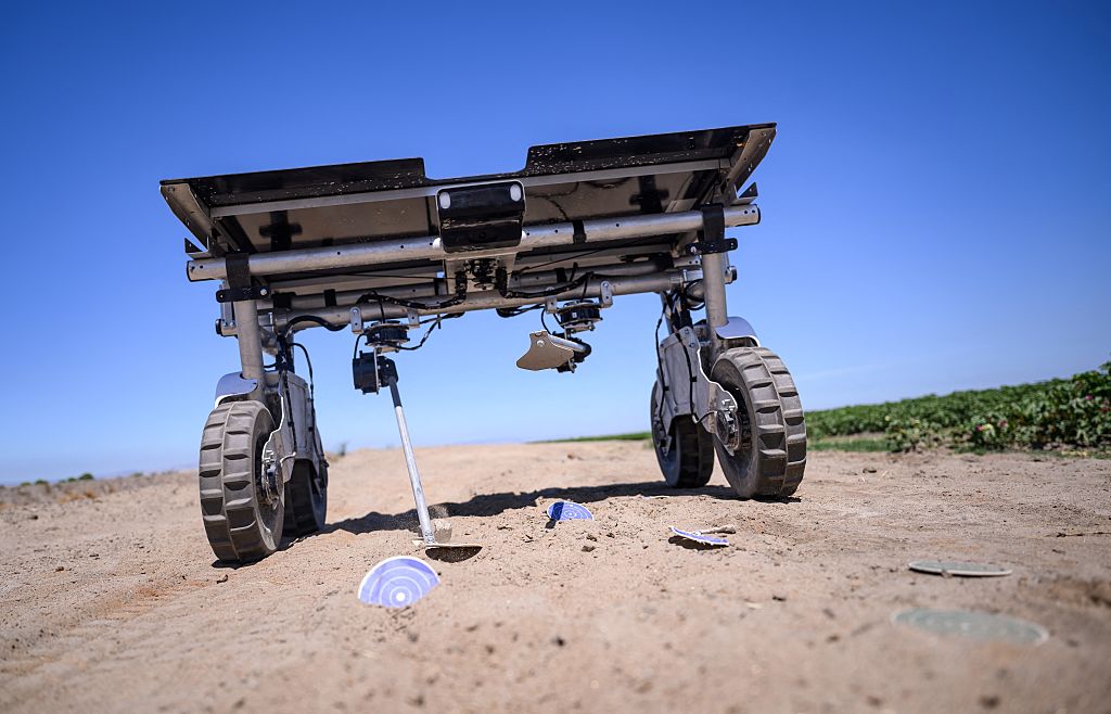 A solar-powered autonomous AI robot demonstrates how it can hammer down on specified targets at a farm in Los Banos, Calif., on June 26, 2025. (Josh Edelson/AFP via Getty Images)
