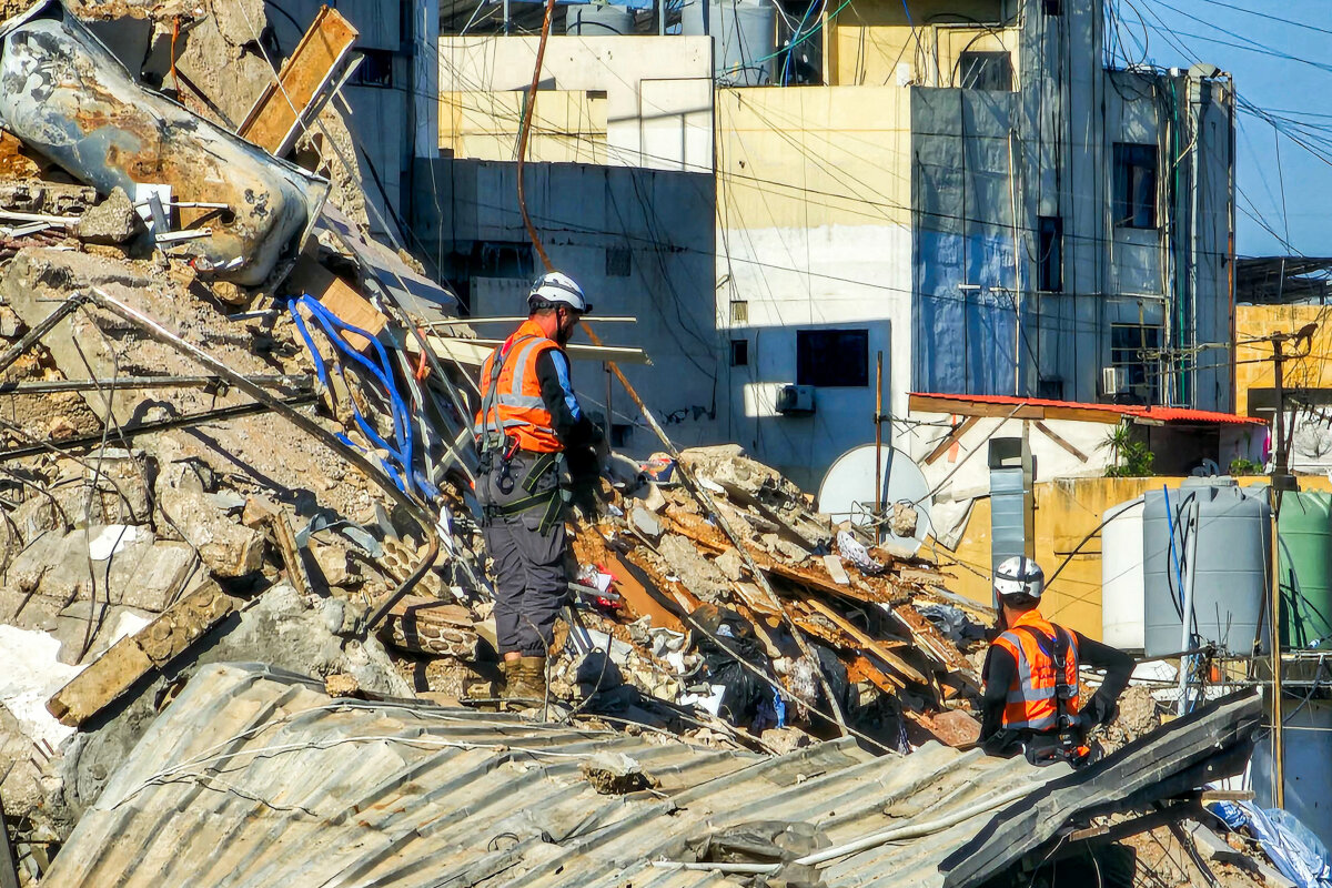 First responders inspect collapsed rubble atop a building following an Israeli airstrike the previous day in the Haret Hreik neighbourhood of Beirut's southern suburbs, Lebanon, on May 7, 2026. (AFP via Getty Images)