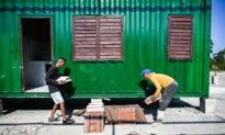 Day in Photos: Shipping Containers Housing, Mail Carriers’ Strike, and ISIS-Linked Women Returning to Australia